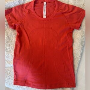 Lululemon race length swiftly sz 4 orange/red